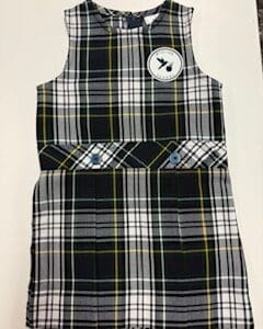 Plaid sleeveless dress with embroidered patch.
