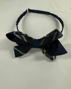 Headband with navy blue plaid bow.